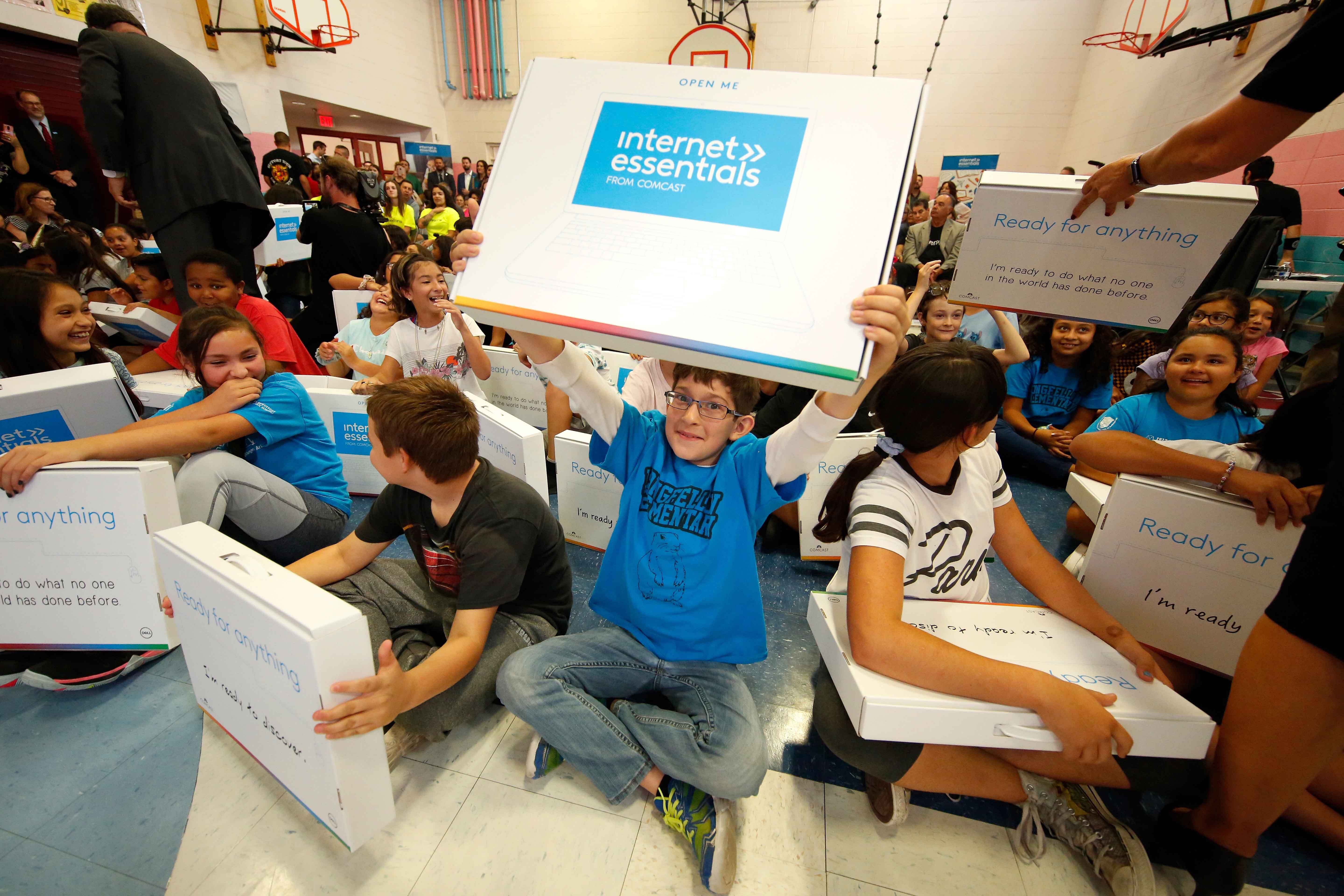 Students cheer at an Internet Essentials event.