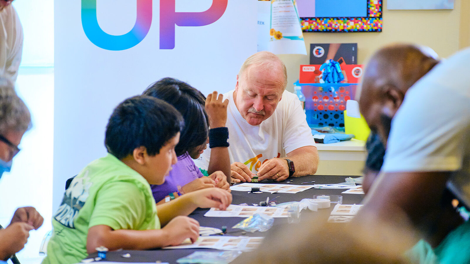 Comcast volunteers participate in Easterseal’s toy modification workshop as part of Team UP.