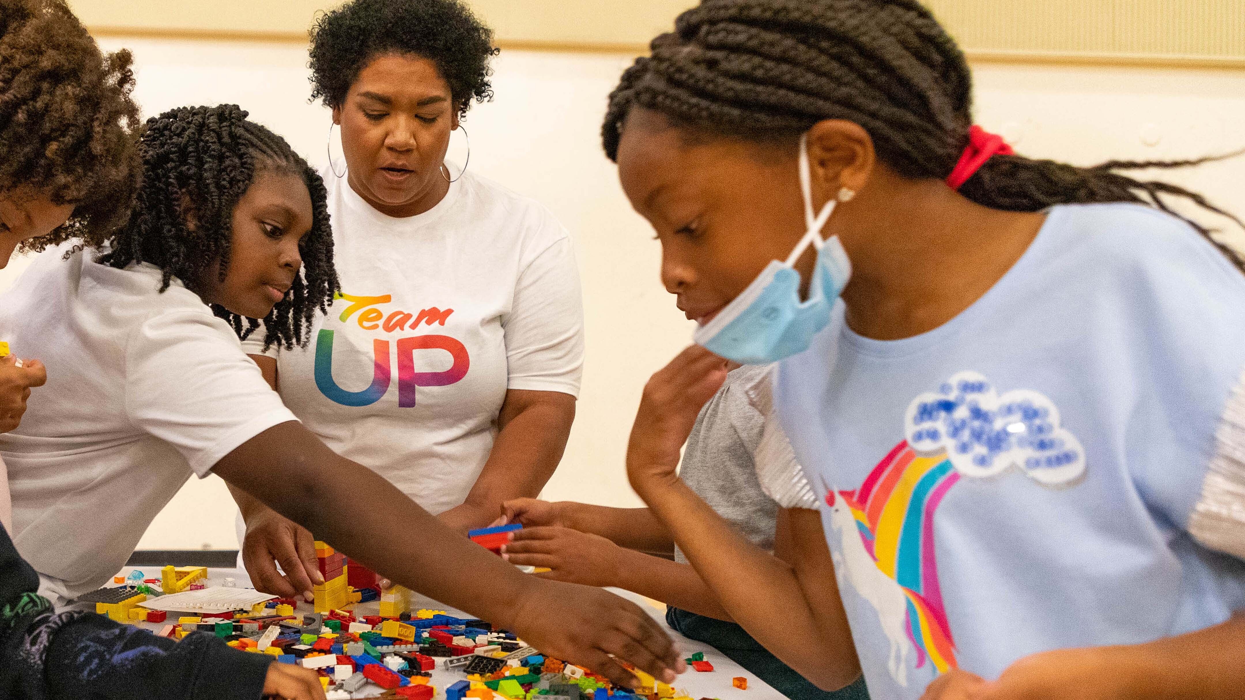 Team UP volunteers at a LEGO builing event.