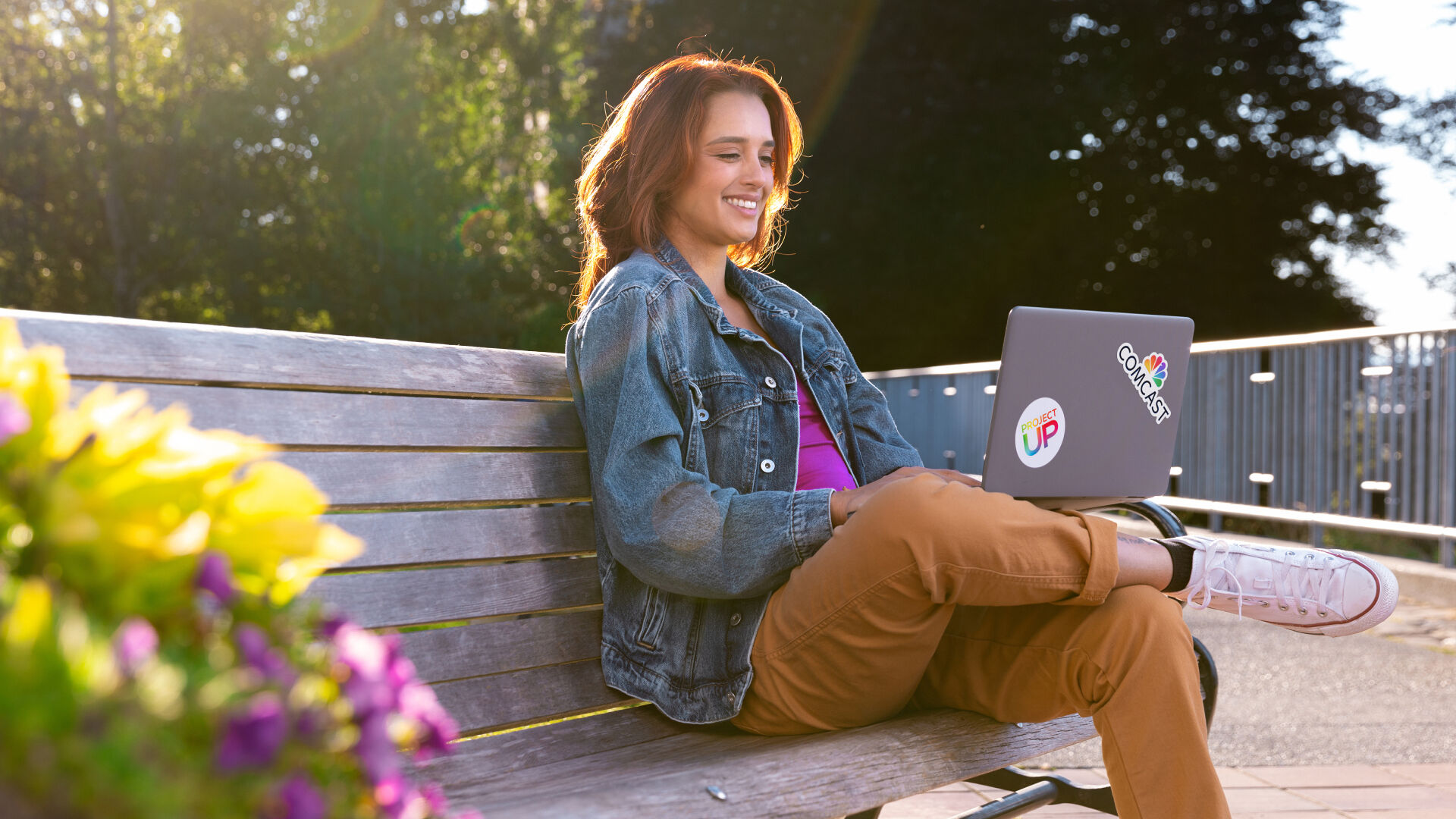 A young woman using a laptop outside of a Lift Zone.