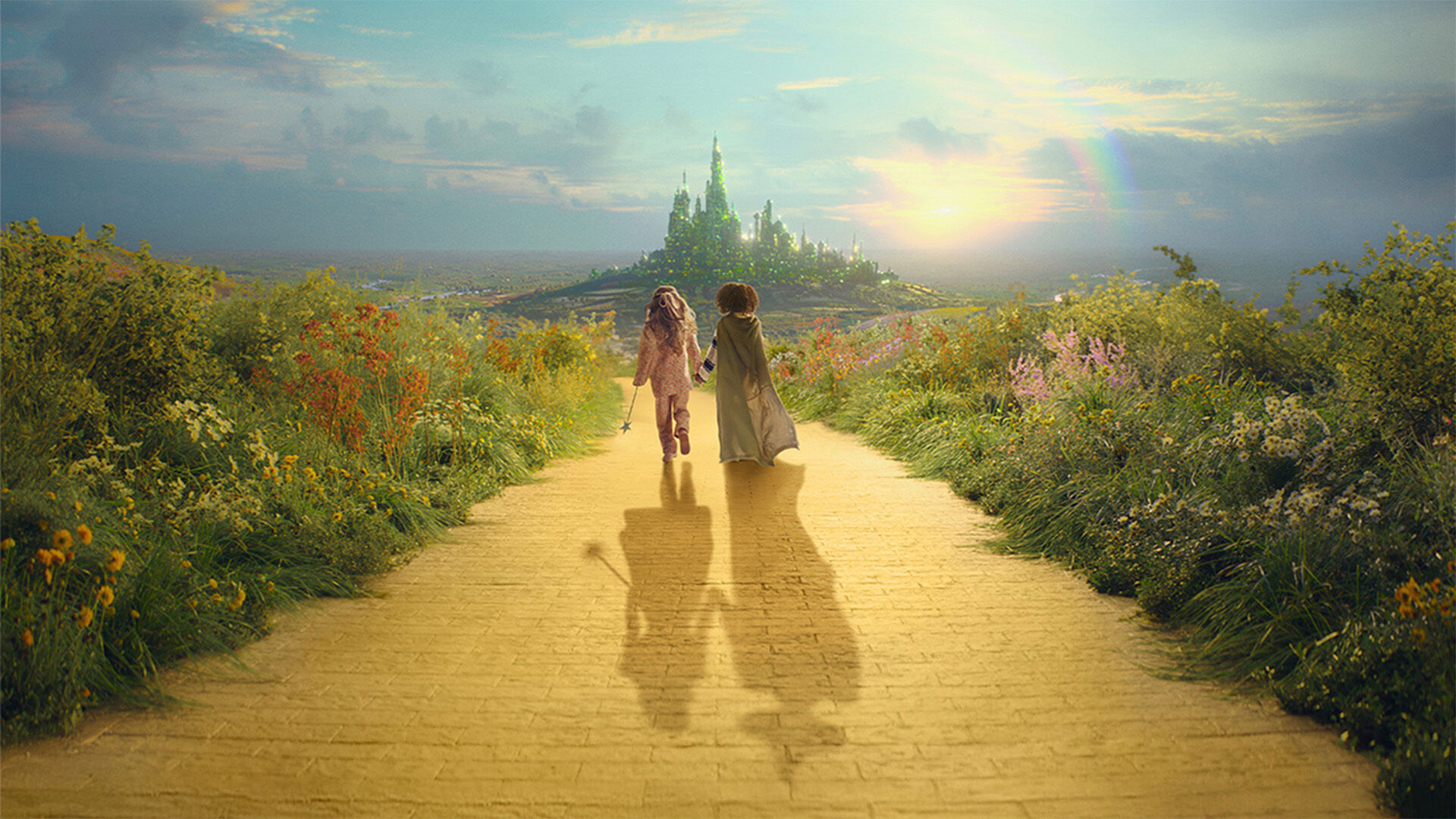 Two young girls walking hand in hand down the yellow brick road.