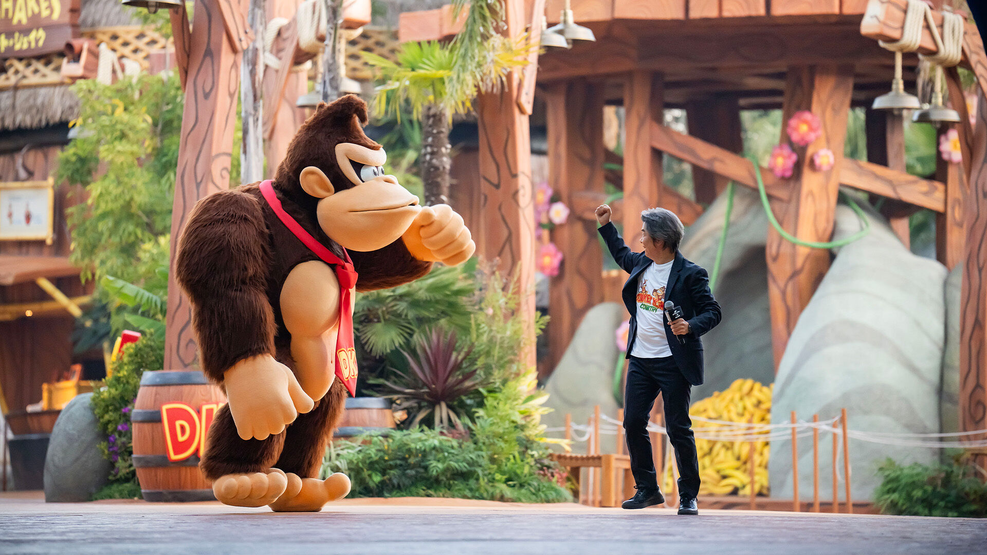 Shigeru Miyamoto interacting with Donkey Kong during the Grand Opening Ceremony